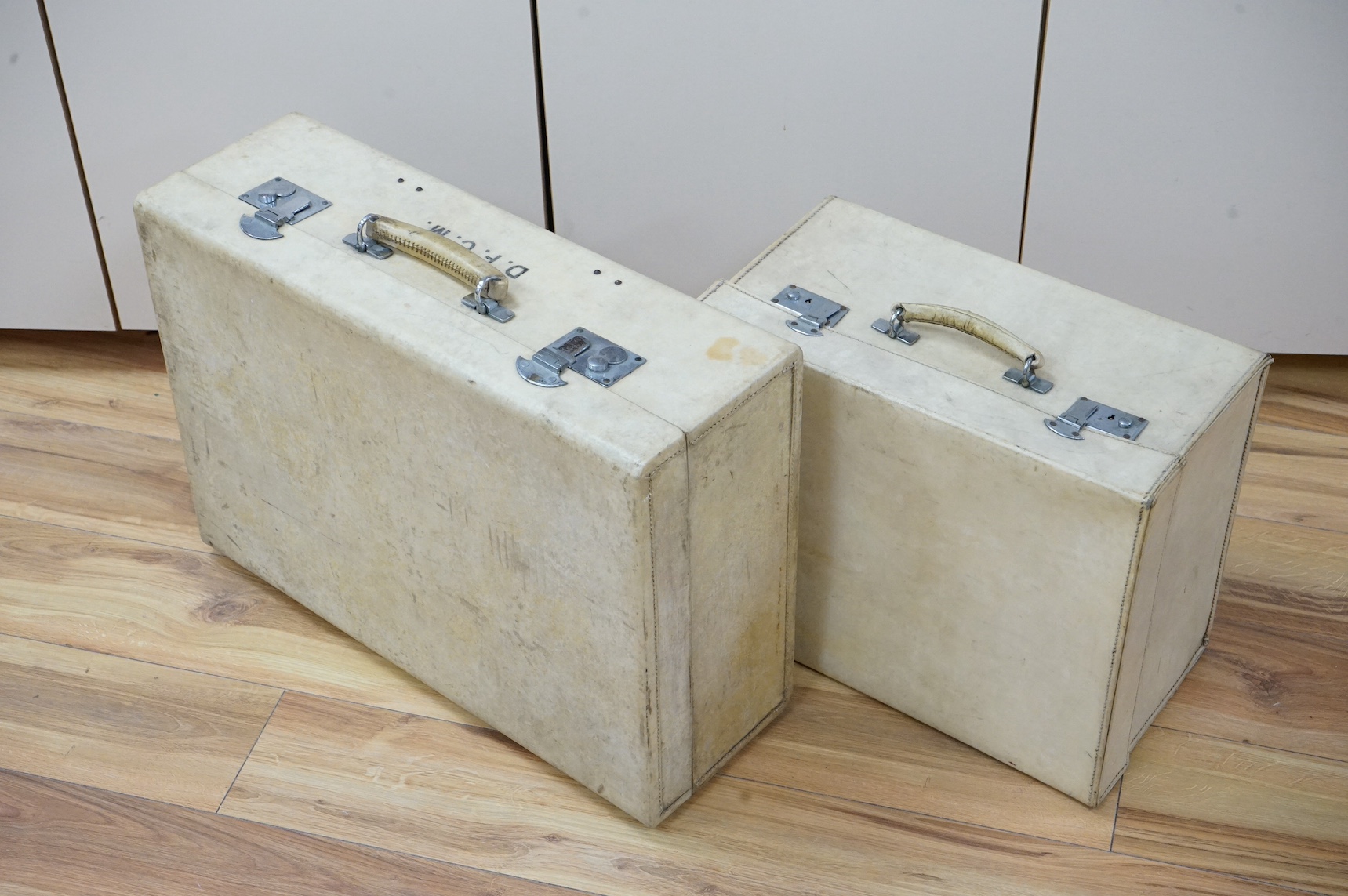 Two calf-skin vellum cases, one with watered silk lining and others. Condition - fair